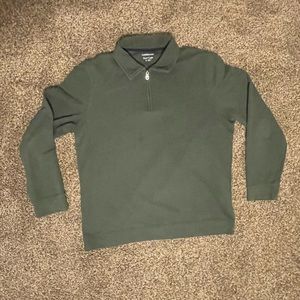 Green quarter zip collared shirt and cream collared polo shirt